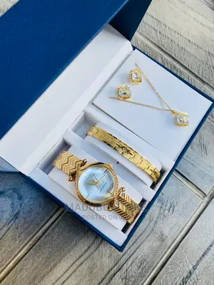 A Set of Watch, Bracelet, Necklace and Earrings