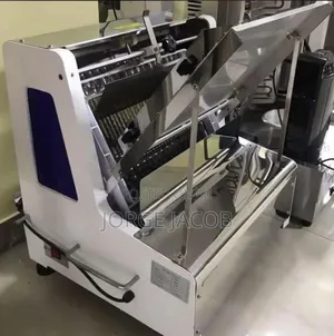 Machine Used for Slicing Loaves of Bread Evenl