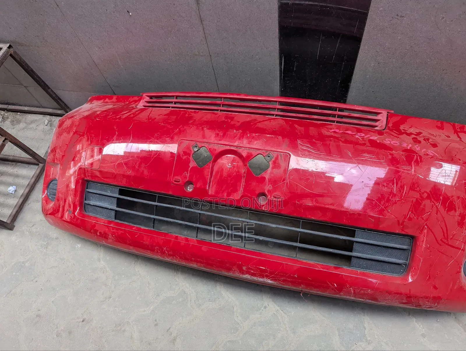 Red Front Bumper for a Toyota Porte.