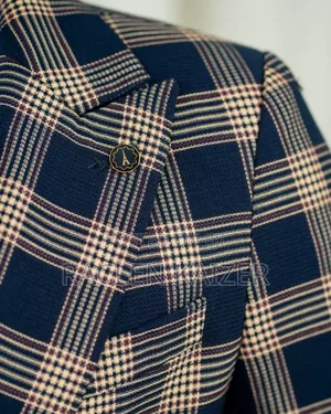 A Navy Suit With Beige Checkered Jacket, Vest, and Navy Trousers