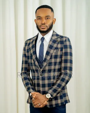 A Navy Suit With Beige Checkered Jacket, Vest, and Navy Trousers