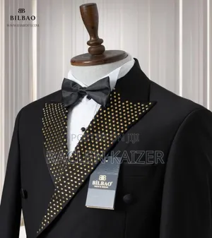 Black Suit With Black Satin Lapels Adorned With Gold Embellishments