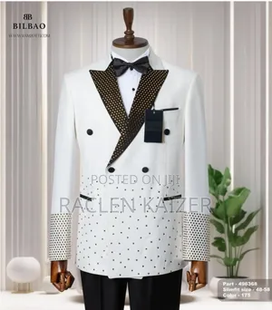 A White Jacket With Satin Lapels Adorned With Gold Embellishment