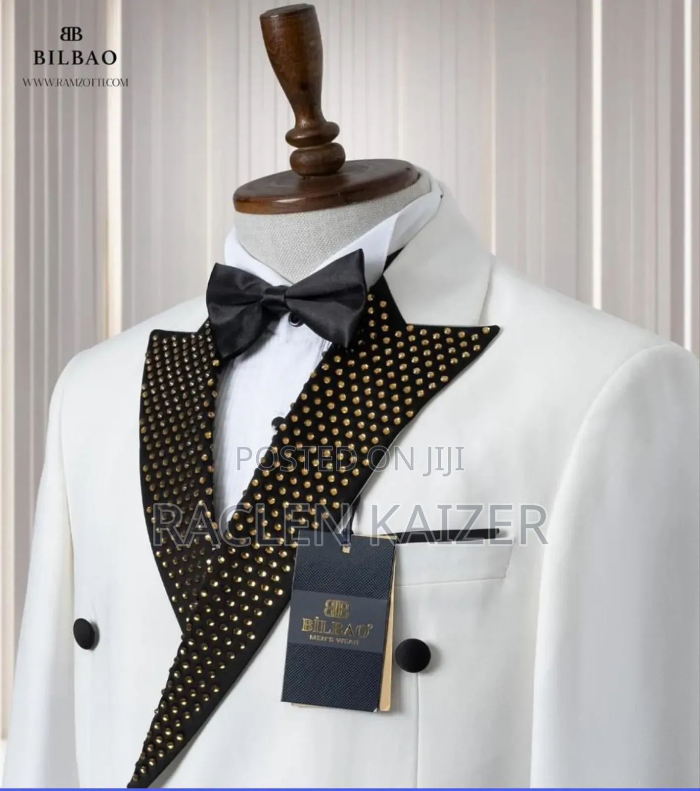 A White Jacket With Satin Lapels Adorned With Gold Embellishment