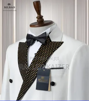 A White Jacket With Satin Lapels Adorned With Gold Embellishment