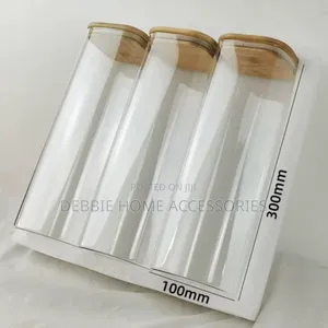 Three Glass Storage Jars With Bamboo Lids.