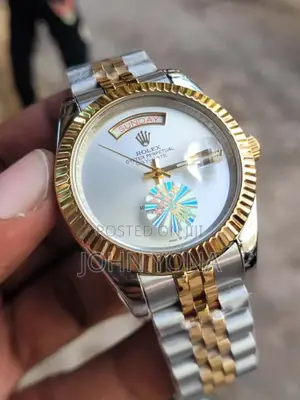 Rolex Day-Date Watch With a Two-Tone Metal Band and a White Face