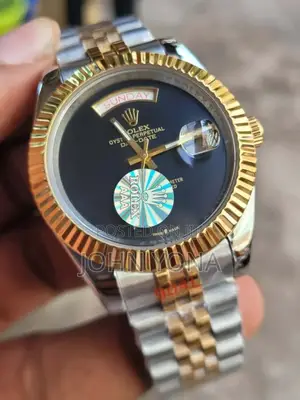 Rolex Day-Date Watch and a Black Dial