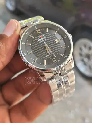 Orient Agent Automatic Watch With a Silver and Black Pin-Striped Dial