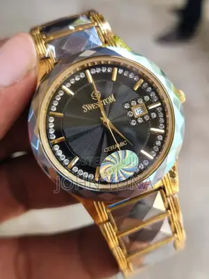 Swestom Watch Gold-Toned Band a Black Dial and Sapphire Ceramic Face
