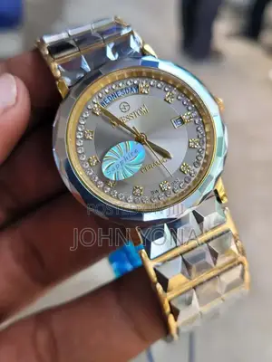 Sesstom Wristwatch With a Gold-and-Silver-Toned Band