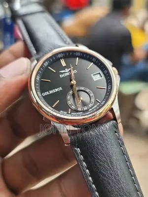 Domino Goldiebox Watch With a Black Face and a Black Leather Strap