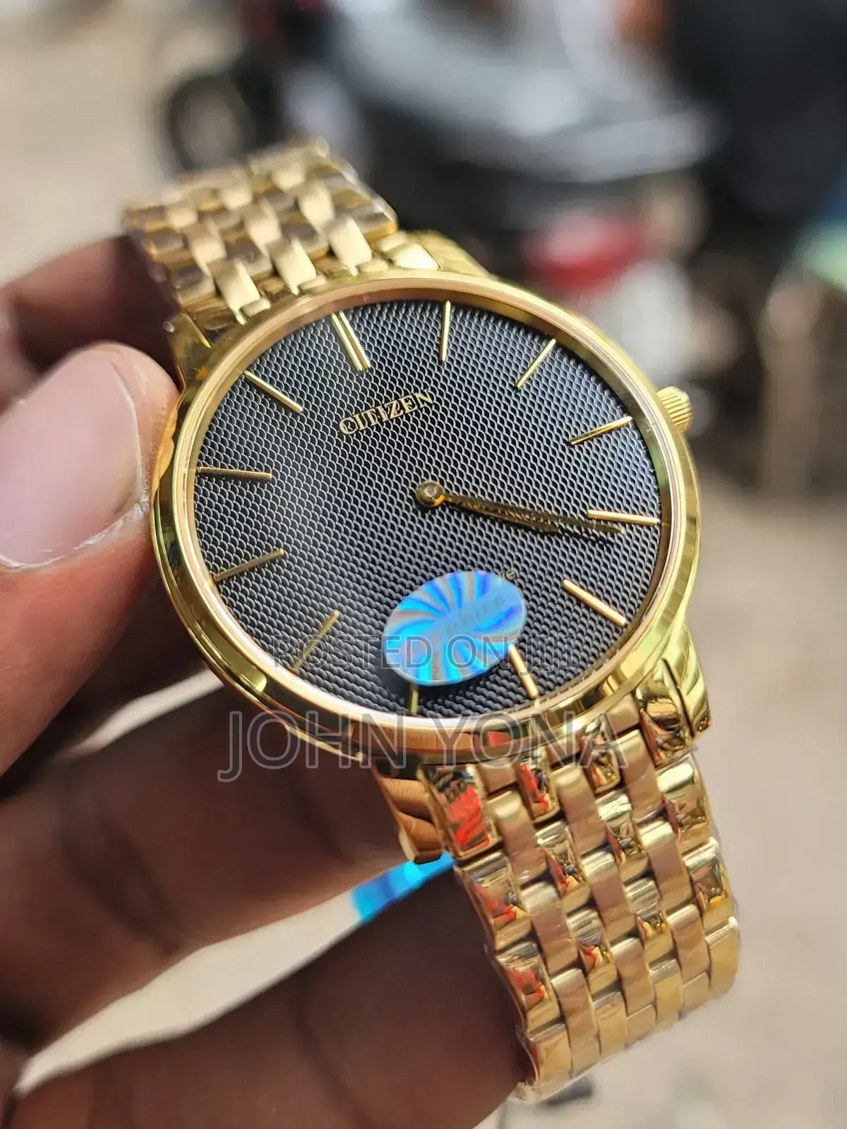 Citizen Wristwatch With a Black, Textured Dial