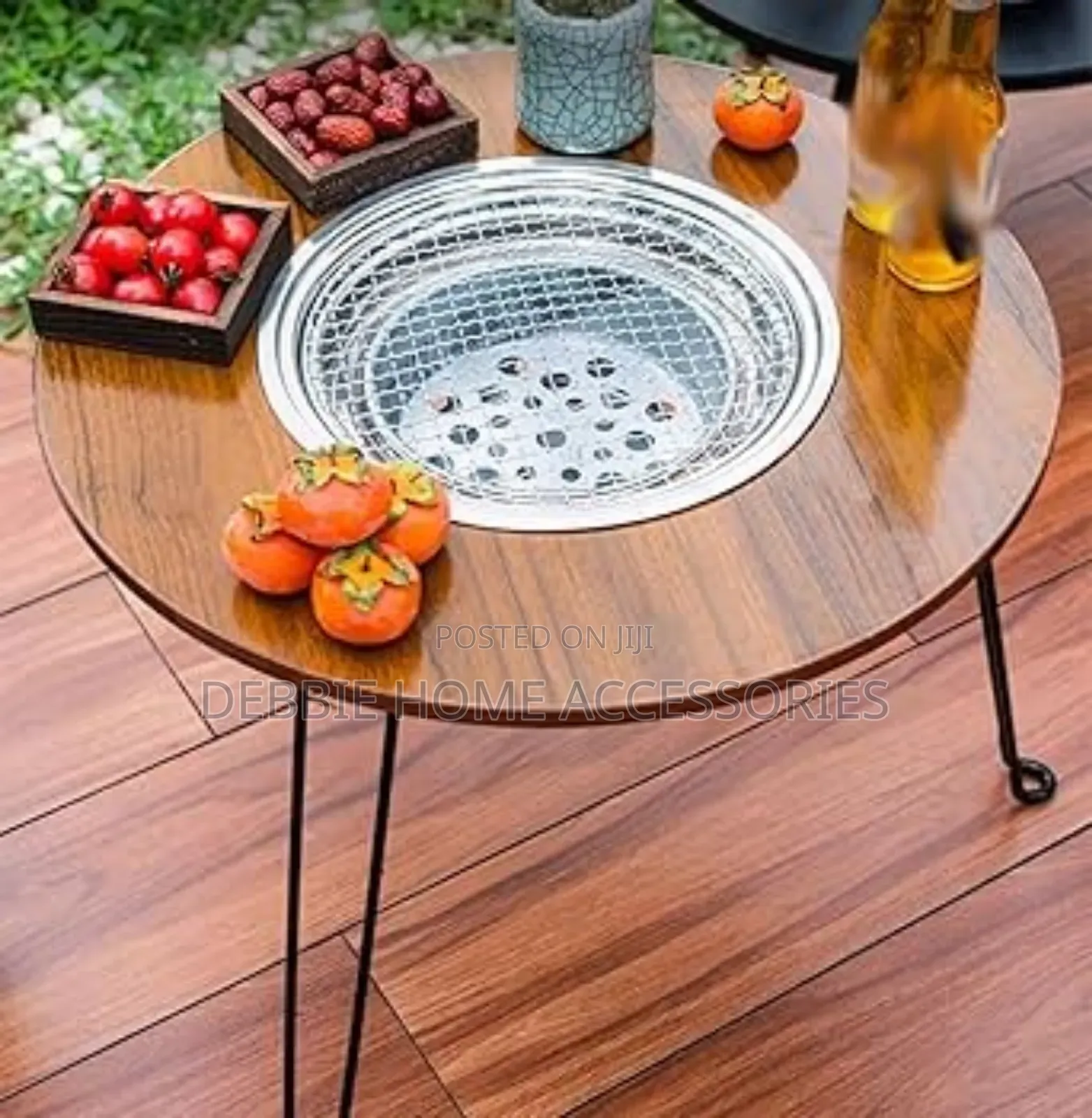 A Portable, Multifunctional Charcoal Barbecue Grill Table.