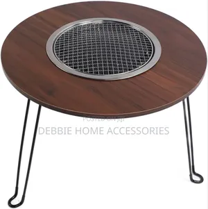A Portable, Multifunctional Charcoal Barbecue Grill Table.