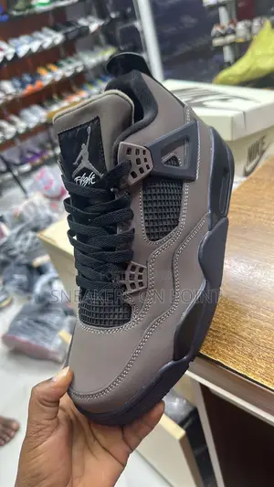 Nike Air Jordan 4 Retro Sneakers in the “Cave Stone and Black “