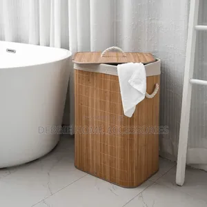 Natural Bamboo Laundry Hamper With a Lid and Rope Handles.