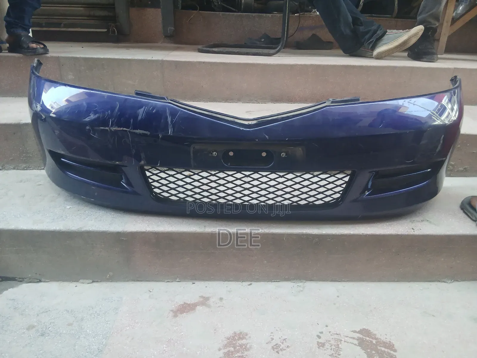 This Is a Used Front Bumper for a Mazda Demio (Dy Series, or Mazda 2).