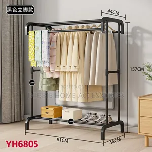 Double-Pole Metal Garment Rack With Storage Shelves.