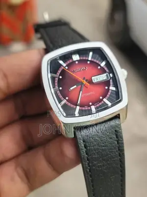 Seiko Recraft Snkp27 Watch With a Red Dial and a Black Leather Strap