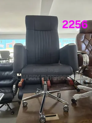 High-Back Executive Office Chair It Features a Chrome Base With Wheels