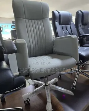 High-Back Executive Office Chair It Features a Chrome Base With Wheels
