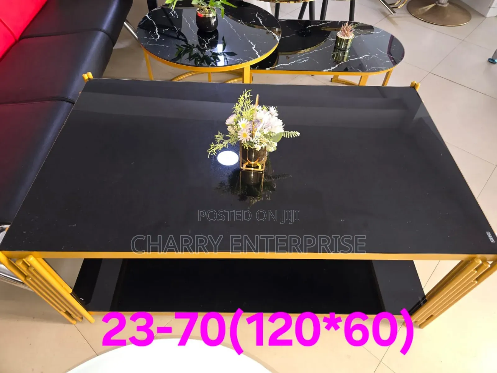 Modern Black Glass Top Coffee Table Featuring a Gold-Finished Frame