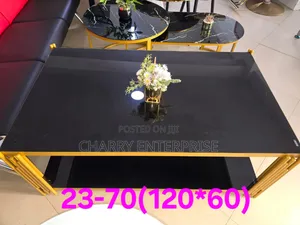 Modern Black Glass Top Coffee Table Featuring a Gold-Finished Frame