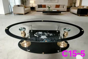 Luxury Oval Glass Coffee Table With Floral Design and Gold/Chrome Legs