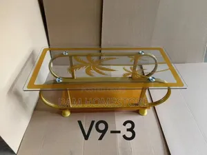 Elegant Glass Coffee Table Withpalm Tree Design and Curved Metal Frame