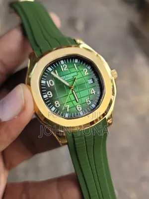 Patek Philippe Aquanaut With a Gold Case and Green Rubber Strap