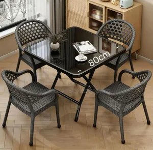 Foldable Table With Modern White/Gray Faux-Rattan Armchairs