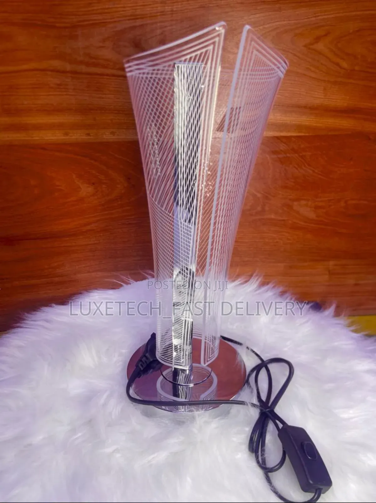 Modern Decorative Bedside Lamp Designed With a v-Shaped Acrylic Shade
