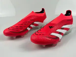 Adidas Predator Elite Laceless Firm Ground Cleats in a Red