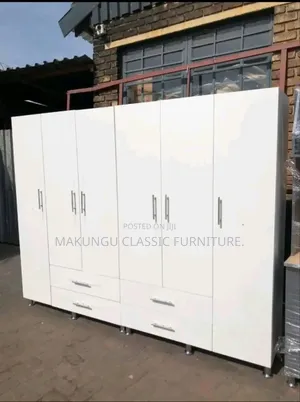 Six Doors Wardrobe With Simple White Color