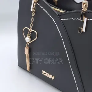Chic Black Handbag With Stylish Heart Charm