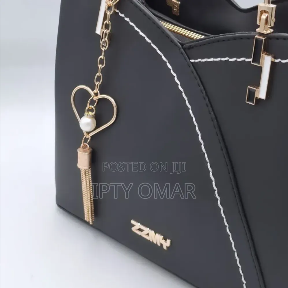 Chic Black Handbag With Stylish Heart Charm