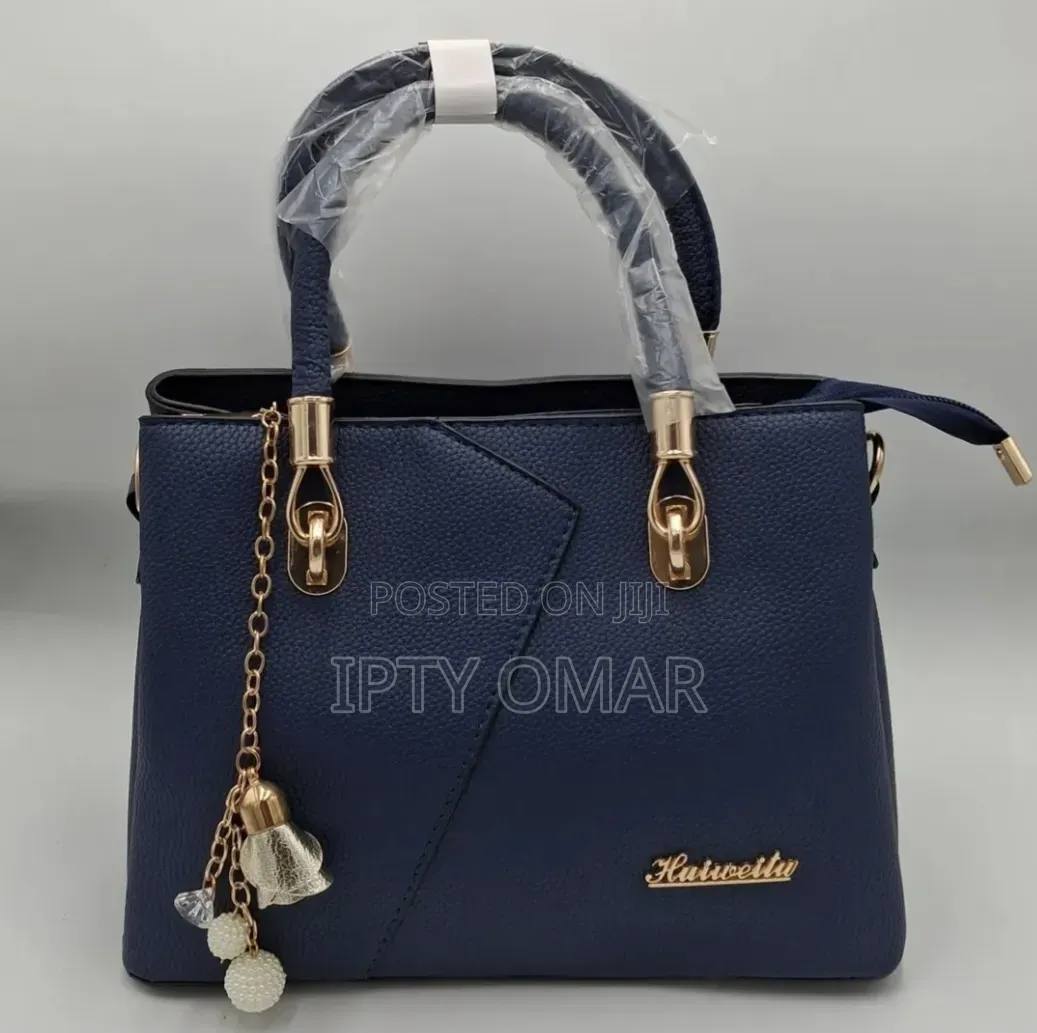 Navy Blue Handbag With Gold Accents and a Keychain