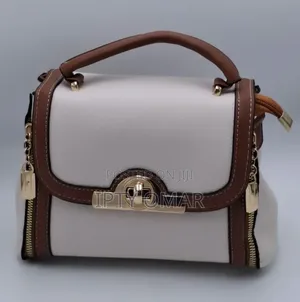 White Handbag With Brown Accents and Gold-Tone Details