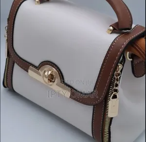 White Handbag With Brown Accents and Gold-Tone Details
