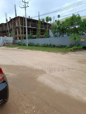 Plot for Sale in Masaki With the Building Inside the Compound