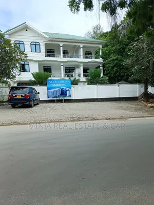 Plot for Sale in Masaki With 2 Floors Building