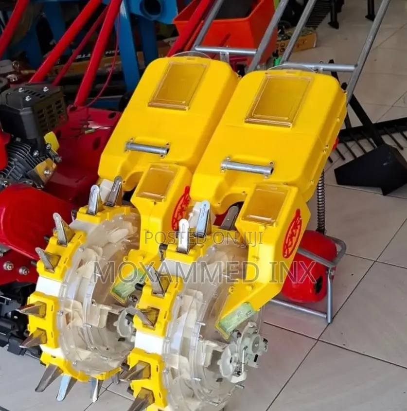 Hand-Propelled, Wheel-Rolling Agricultural Seeder and Planter