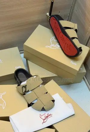 Christian Louboutin Sandal Are Beige Suede and Cl Branded Strap Detail