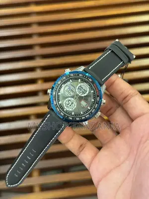 Sporty Watch Features Blue Bezel and Comfortable Black Silicone Strap