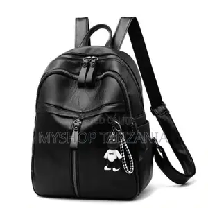 Leather Backpack a Front Zipper Pocket and a Small Decorative Bear