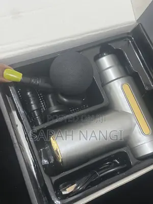 Beauty -Massage Gun Used to Reduce Tension on Body Parts