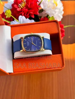Gold Tone Casio Quartz Dial Watch Featuring Striking Blue Strap