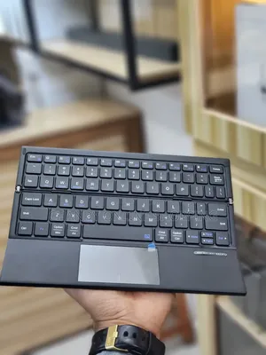 Harmonica Folding Keyboard Bluetooth Connection and Built-in Touchpad.